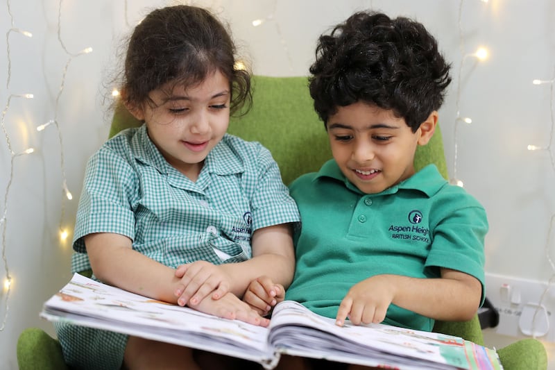 Salama and Saeed, both 5, catch up on some reading in the Calm Corner.