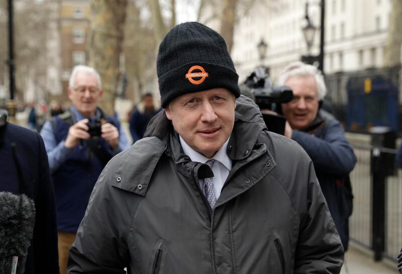 FILE - In this Tuesday, March 19, 2019 file photo, Boris Johnson, Britain's former Foreign Secretary and prominent leave the European Union Brexit campaigner walks away after leaving the Cabinet Office in London. Britainâ€™s High Court has quashed a bid to prosecute Conservative lawmaker Boris Johnson for allegedly lying during the countryâ€™s 2016 European Union membership referendum. Two judges on Friday, June 7 threw out a lower courtâ€™s ruling that Johnson should be summoned to answer questions about Brexit campaignersâ€™ claim that Britain pays 350 million pounds ($446 million) a week to the EU. (AP Photo/Matt Dunham, File)