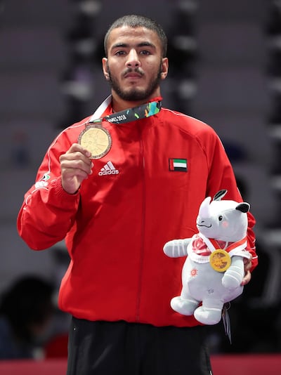 epa06968727 Gold medalist Hamad Nawad of United Arab Emirates poses during the medal ceremony after the men's 56 kg Ju-Jitsu Gold Medal Match at the 18th Asian Games Jakarta-Palembang 2018 in Jakarta, Indonesia, 24 August 2018.  EPA/ADI WEDA