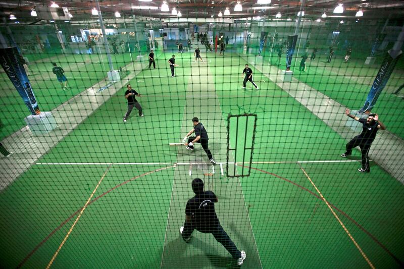 Dubai - August 17, 2010 - The Ramadan Cricket League teams play on small, netted, indoor courts at The Chevrolet Insportz club In the Al Quoz area in Dubai, August 17, 2010. (Photo by Jeff Topping/The National) 