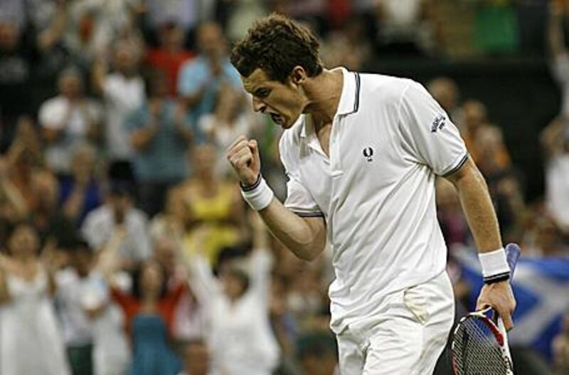 Andy Murray celebrates clinching victory over Stanislas Wawrinka in the fourth-round on Monday evening.