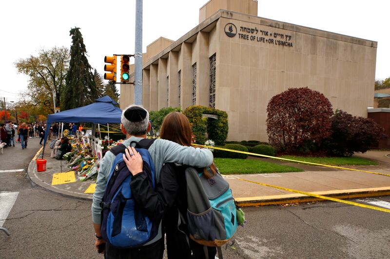 People pay their respects at a makeshift memorial outside the Tree of Life Synagogue in November 2018. AP