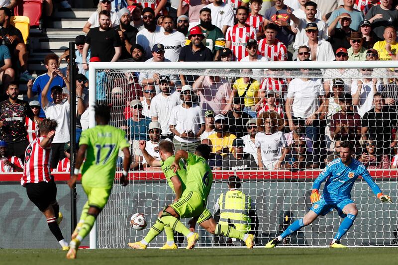 Brentford's Danish midfielder Mathias Jensen shoots to score their second goal. AFP