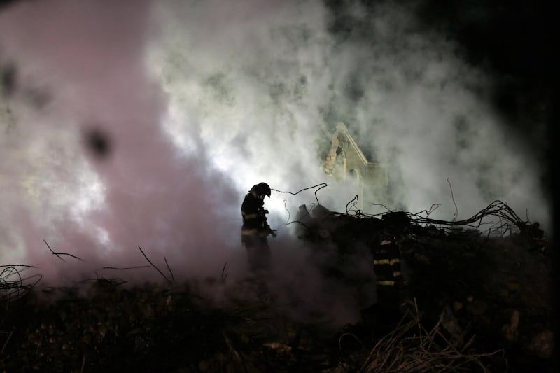 Firefighters work at the site where a building collapsed, in downtown Sao Paulo, Brazil. Paulo Whitaker / Reuters