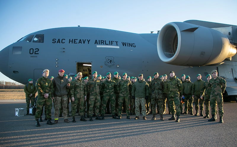 Norwegian soldiers of the Nato-enhanced forward presence battalion pose at a military plane as they arrive at an airport in Kaunas, Lithuania. AP