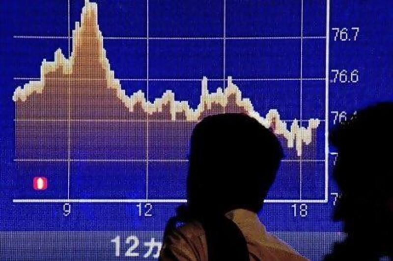 Global stock markets ended a turbulent week with shares falling sharply. In Japan, the Nikkei ended at a five-month low and the dollar was near its postwar record low of 76.25 yen. EPA