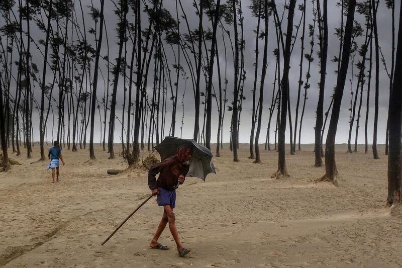 A Bangladeshi villager walks to a cyclone shelter on the coast in Cox’s Bazar as Cyclone Mora approaches. AFP Photo