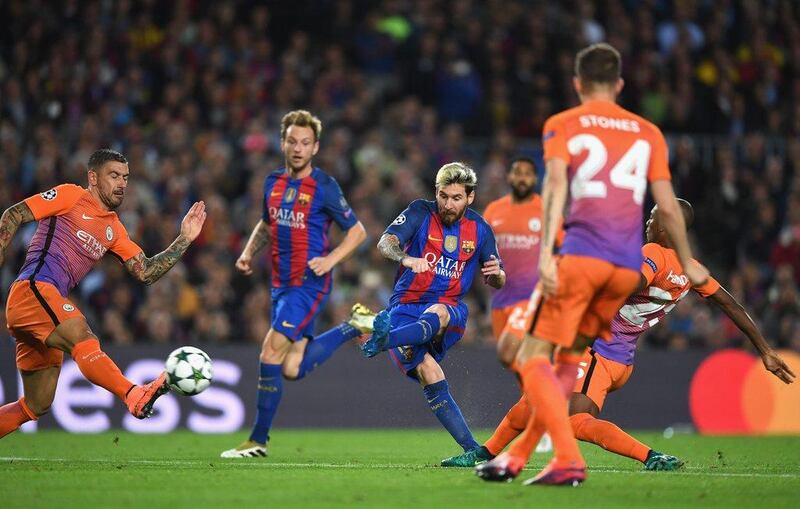 Lionel Messi of Barcelona scores his team’s second goal. Shaun Botterill / Getty Images