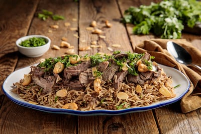Majlis Al Sultan's National Day exclusive item is a traditional oven-roasted lamb shoulder over a plate of spiced oriental rice or freekeh with nuts. Photo: Majlis Al Sultan