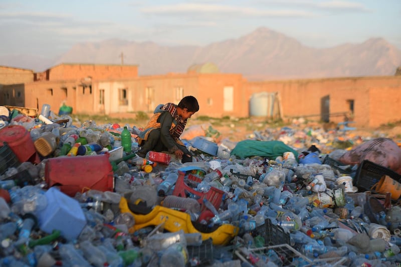 An Afghan child works in a plastic recycle factory on the outskirts of Mazar-i-Sharif.  AFP
