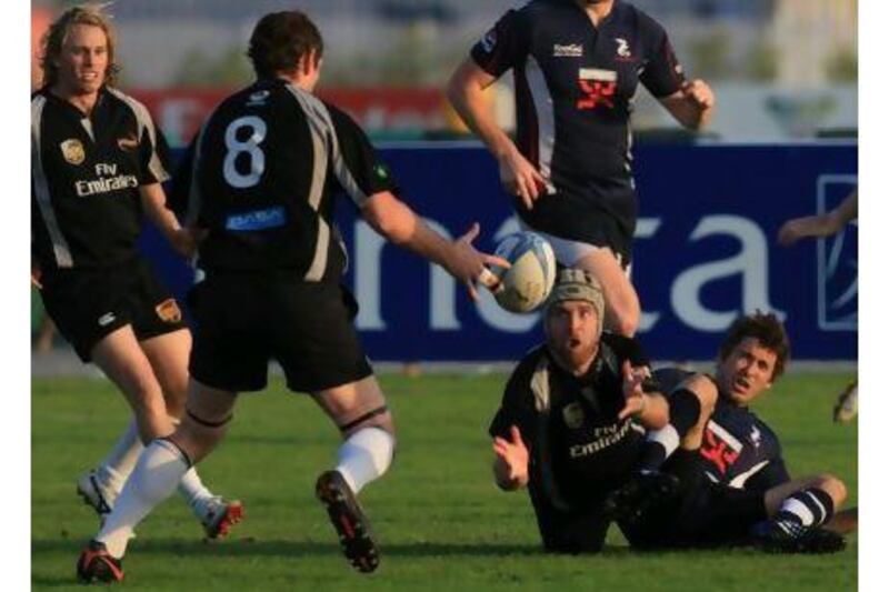 A Dubai Hurricanes player passes the ball during last week's defeat to the Dragons.