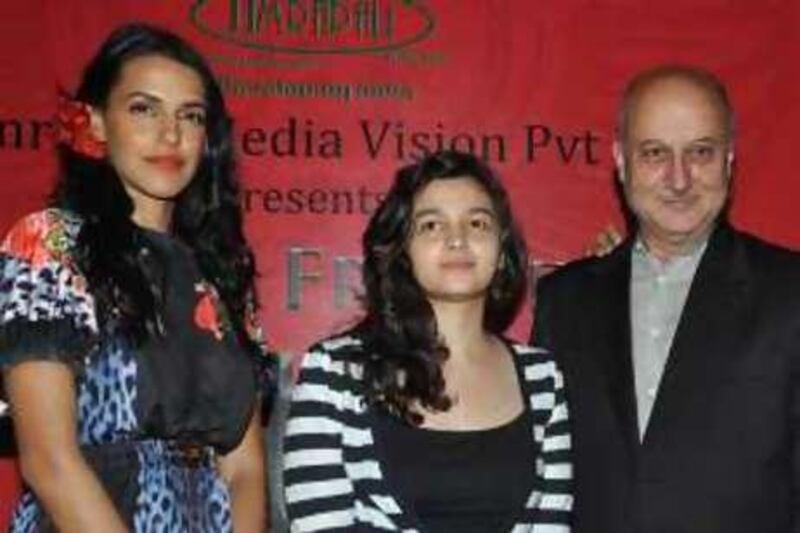 Indian Bollywood actors Neha Dhupia, Aliya Bhatt and Anupam Kher attend the launch of Hindi and English film "Dear Friend Hitler” in Mumbai June 6, 2010.  AFP PHOTO/STR.