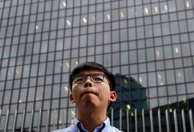 Pro-democracy activist Joshua Wong pauses during a press conference in Hong Kong, Tuesday, Oct. 29, 2019. Hong Kong authorities disqualified high-profile pro-democracy activist Joshua Wong from upcoming local council elections, in the latest sign of deepening division in the semiautonomous Chinese city wracked by months of protests. (AP Photo/Vincent Yu)