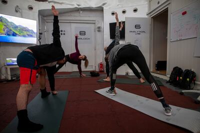 Egyptian astronaut Sara Sabry leads a group of astronaut trainees on a yoga workout at the LunAres analog space station in Poland. For astronauts, exercise is essentially to combat the drop in bone density and muscle atrophy they experience off-planet. Photo: LunAres Research Station