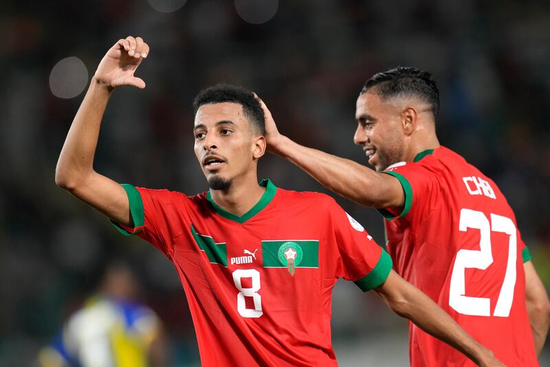 Azzedine Ounahi, left, celebrates with Mohamed Chibi after scoring Morocco's second goal. AP