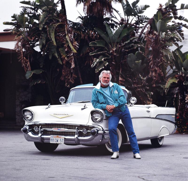 BEVERLY  HILLS , CA - JANUARY 15: Kenny Rogers with his 1957 convertible Cadillac  January 15, 1990 in Beverly Hills, Los Angeles, California (Photo by Paul Harris/Getty Images)