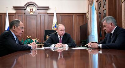Russian President Vladimir Putin, cente, attends a meeting with Russian Foreign Minister Sergey Lavrov, and Defense Minister Sergei Shoigu in the Kremlin in Moscow, Russia, Saturday, Feb. 2, 2019. Putin said that Russia will abandon the 1987 Intermediate-Range Nuclear Forces treaty, following in the footsteps of the United States, but noted that Moscow will only deploy intermediate-range nuclear missiles if Washington does so. (Alexei Nikolsky, Sputnik, Kremlin Pool Photo via AP)