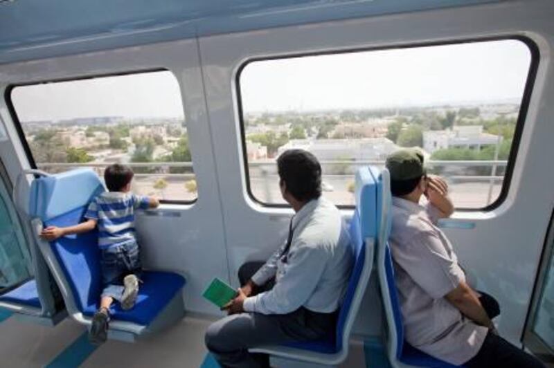 UAE - Dubai - Sep 11 - 2011:   People ride the train of the Dubai Metro's Green Line. ( Jaime Puebla - The National Newspaper )