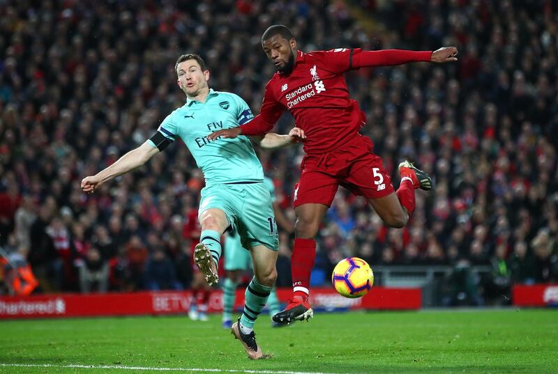 LIVERPOOL, ENGLAND - DECEMBER 29:  Georginio Wijnaldum of Liverpool and Stephan Lichtsteiner of Arsenal in action during the Premier League match between Liverpool FC and Arsenal FC at Anfield on December 29, 2018 in Liverpool, United Kingdom.  (Photo by Clive Brunskill/Getty Images)