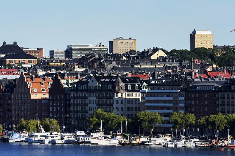 Residential apartment blocks stand near vessels on the waterfront in the Norrmlarstrand district of Stockholm, Sweden, on Wednesday, June 28, 2017. Just as Sweden’s biggest mortgage banks start raising interest rates, the country’s state-backed home-loan provider says it’s cutting customers’ borrowing costs in a move that threatens to hurt industry profits after years of negative rates. Photographer: Mikael Sjoberg/Bloomberg
