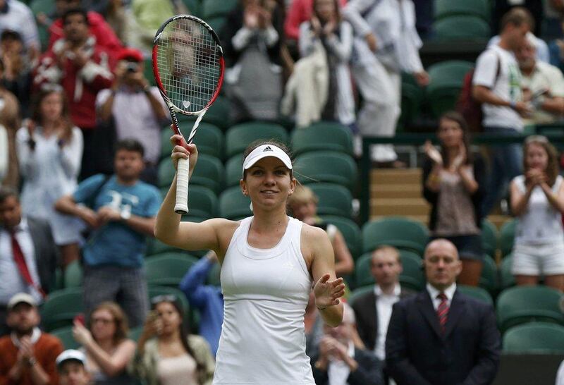 Simona Halep reacts after her first-round win at the 2014 Wimbledon Championships on Tuesday in London, England. Suzanne Plunkett / Reuters / June 24, 2014