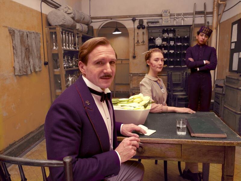 A handout photo showing (L-R) Ralph Fiennes, Saoirse Ronan, and Tony Revolori in "The Grand Budapest Hotel" (Courtesy: Fox Searchlight)