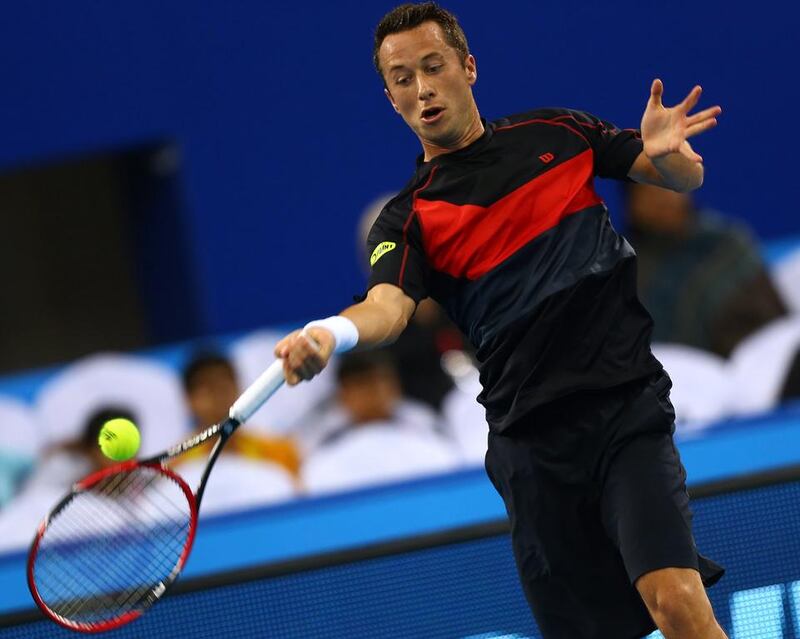 Germany's Philipp Kohlschreiber of Manila Mavericks returns the ball to Czech player Tomas Berdych of Singapore Slammers during their singles match on the final day of the IPTL in Dubai. Marwan Naamani / AFP