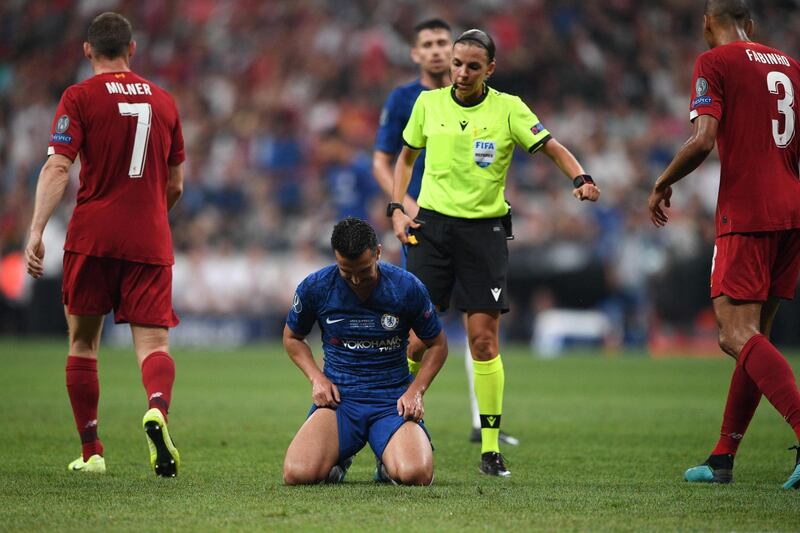 Chelsea's Spanish midfielder Pedro (bottom) reacts in front of French referee Stephanie Frappart. AFP