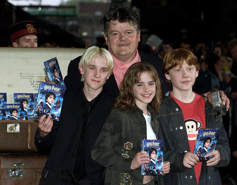 With Harry potter cast members Tom Felton, left, Emma Watson and Rupert Grint in May 2002. Reuters