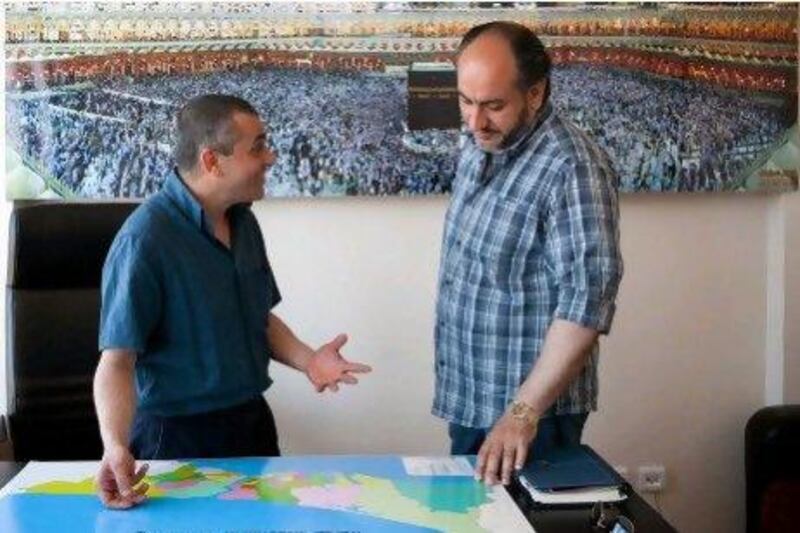 Ugur Pordogan, the general manager of a travel agency, shows areas where he sells properties to a customer from Damascus in Istanbul. He says there are Arab nationals buying properties in Turkey to make money, and others who are buying holiday homes.