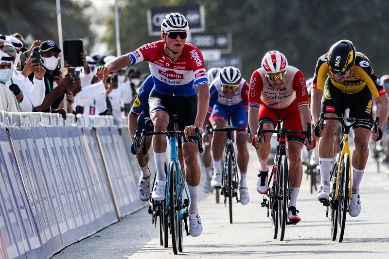 Mathieu van der Poel, of Team Alpecin–Fenix, celebrates as he approaches the finish line to win Stage 1. AFP