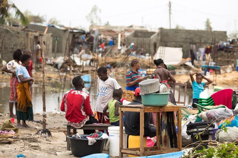 People salvaging iron sheets on the streets of Beira in Praia Nova, Beira, Mozambique. IFRC/EPA