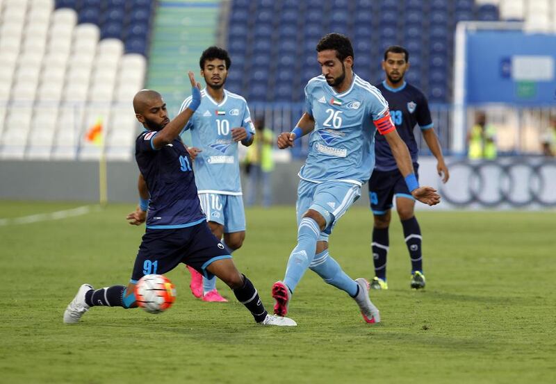 Dibba's Khalifa I ( left) challenges Y Jaber of Baniyas ( right ) for the ball. Host Baniyas would get two goals from Ishak Belfodil and another from Joaquin Larrivey on their way to a 3-0 win on Saturday.  Jeffrey E Biteng / The National 