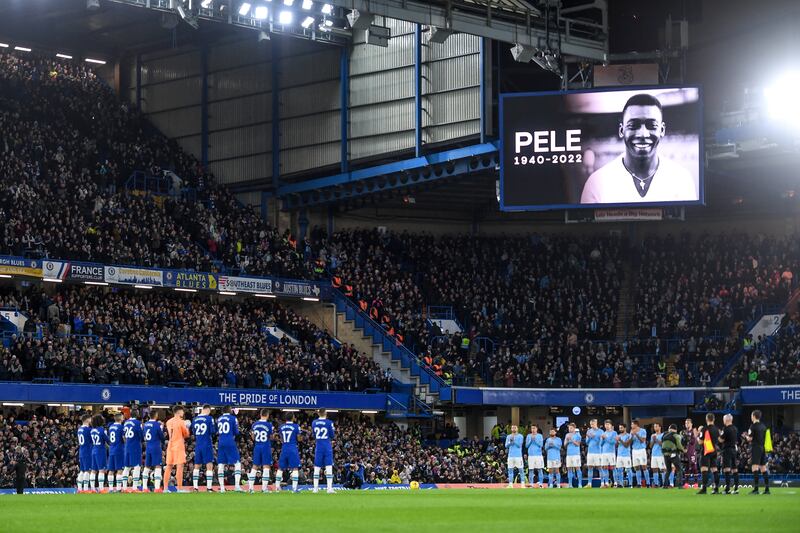 Chelsea and Manchester City players pay tribute to late Brazilian football great Pele before the game at Stamford Bridge. EPA