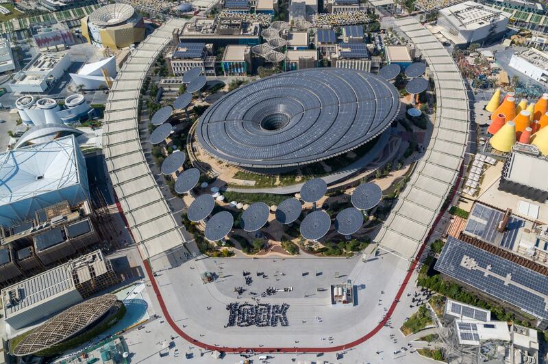 Pupils gathered in front of The Sustainability Pavilion at Expo 2020 Dubai to create a human installation that spelled out the ‘100K’ figure’s four characters. Expo 2020 Dubai