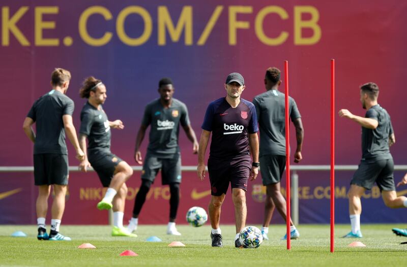 Barcelona coach Ernesto Valverde watches his players in training. Reuters