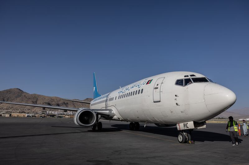 People get off an Ariana Afghan Airlines flight that landed from Herat. Stefanie Glinski for The National