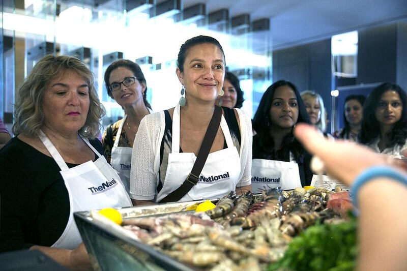 Guests take a peek at the ingredients prepared for their #healthyliving cooking experience. Silvia Razgova / The National