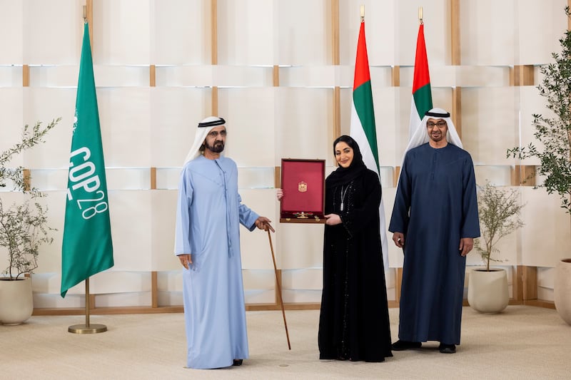 President Sheikh Mohamed and Sheikh Mohammed bin Rashid present a Zayed the Second Medal to Iman Estadi