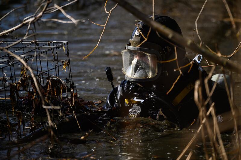 A police diver searches Mount Pond on Clapham Common. Getty Images