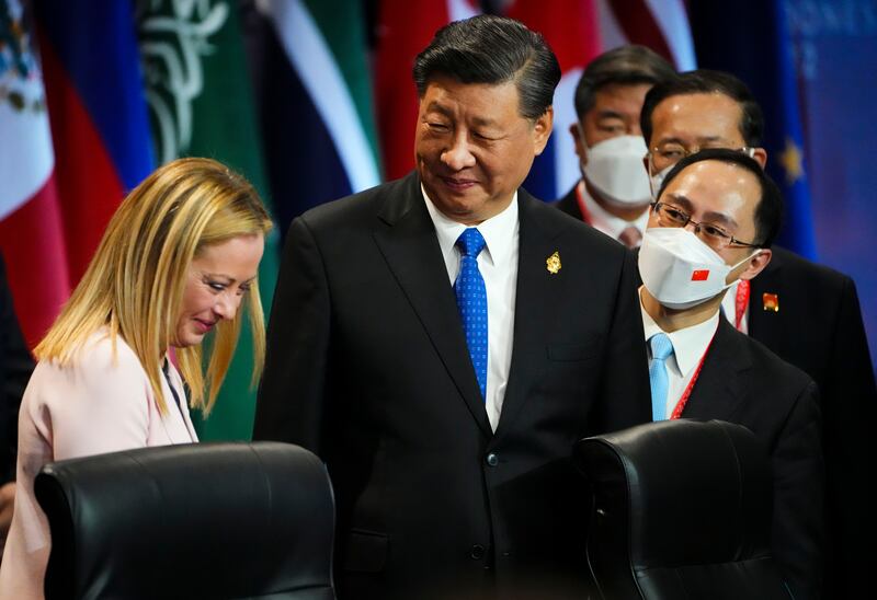 Mr Xi talks with Italian Prime Minister Giorgia Meloni, left, at the summit. AP