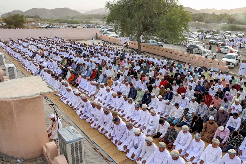 Worshippers perform the morning prayers for Eid al-Adha in the Surur district in Oman's governorate of Samail. AFP