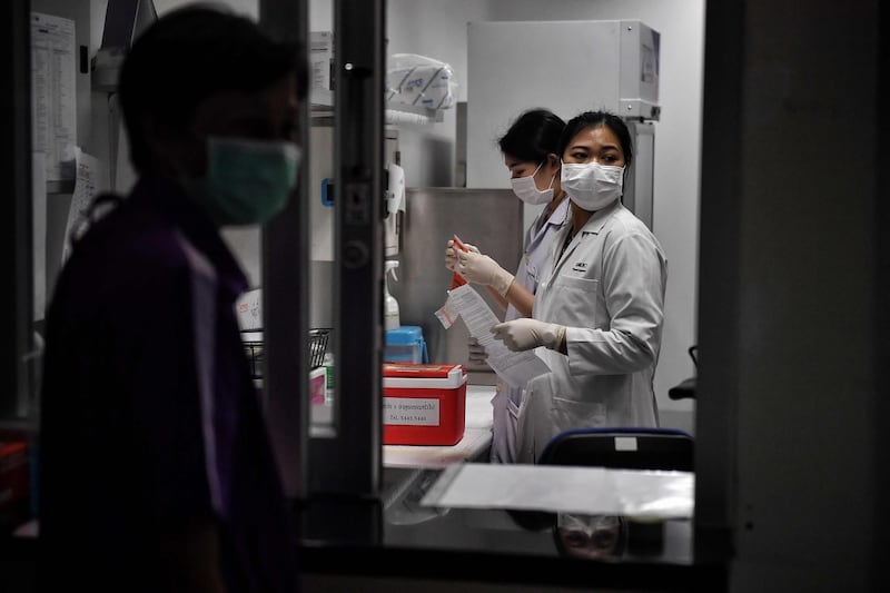 Lab technicians register samples from potential victims of the novel coronavirus at the Centre for Emerging Infectious Diseases of Thailand at Chulalongkorn University in Bangkok. AFP