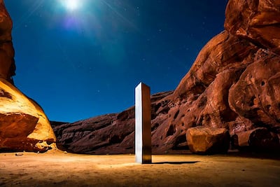 AThis Nov. 27, 2020 photo by Terrance Siemon shows a monolith that was placed in a red-rock desert in an undisclosed location in San Juan County southeastern Utah. New clues have surfaced in the disappearance of the gleaming monolith in Utah that seemed to melt away as mysteriously as it appeared in the red-rock desert. A Colorado photographer told a TV station in Salt Lake City that he saw four men push over the hollow, stainless steel structure in Utah on Friday night. (Terrance Siemon via AP)