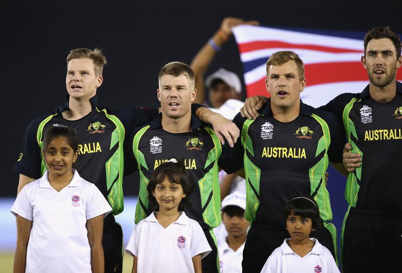 MOHALI, INDIA - MARCH 27:  Steve Smith, David Warner, Aaron Finch and Glenn Maxwell of Australia sing the anthem during the ICC WT20 India Group 2 match between India and Australia at I.S. Bindra Stadium on March 27, 2016 in Mohali, India.  (Photo by Ryan Pierse/Getty Images)