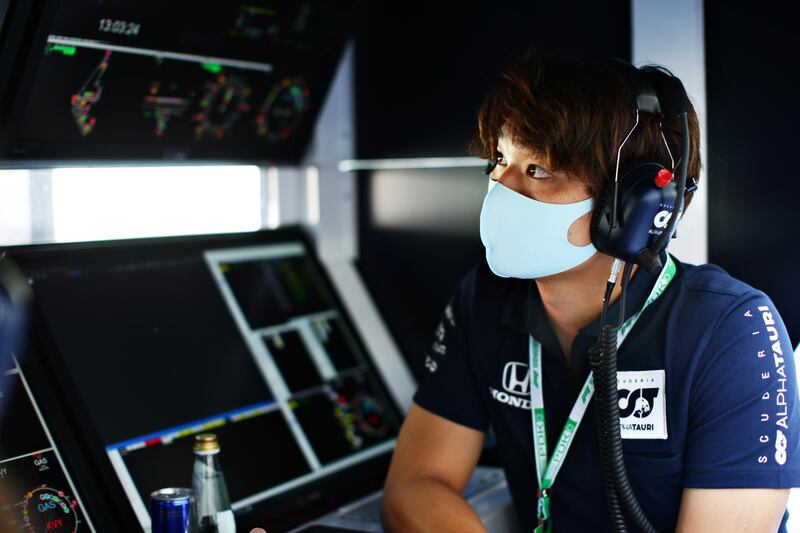 Marino Sato of Japan and Scuderia AlphaTauri looks on from the pit wall. Getty