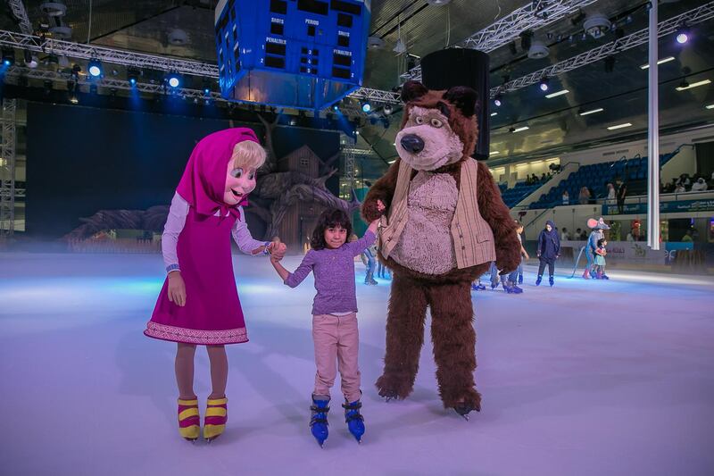 A girl skates with cast from Mash and The Bear On Ice. Photo courtesy Abu Dhabi Tourism & Culture Authority.