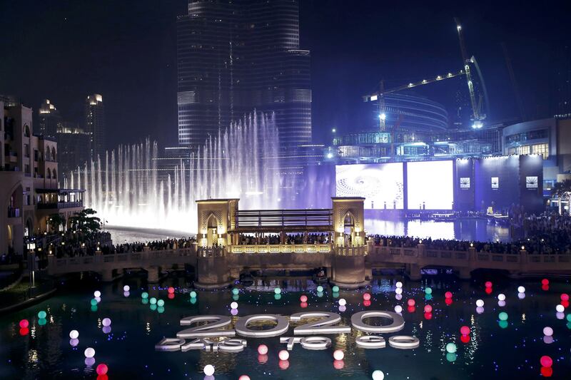 Celebrations underway at the Dubai Mall Fountain where members of the public could register and write their wish on an LED ball which was then set afloat in the fountain. Antonie Robertson/ The National