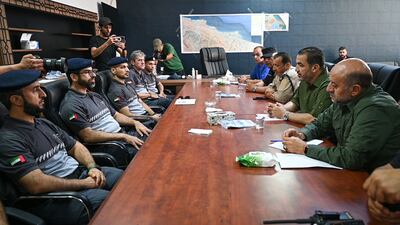 A team from the UAE’s disaster victim identification unit in a meeting with Libyan officials in Derna. Photo: Abu Dhabi Police