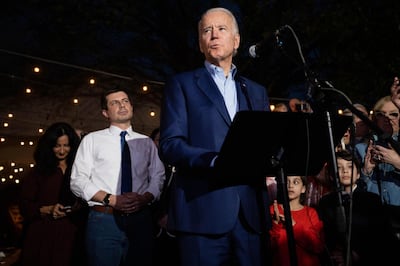 Democratic presidential primary candidate, former Vice President Joe Biden speaks during an event at the Chicken Scratch restaurant the night before Super Tuesday primary voting, on Monday night March 2, 2020 in Dallas. Former Democratic presidential primary candidate Pete Buttigieg, center left, was there to endorse Biden after he stopped his campaign Sunday. (Juan Figueroa/The Dallas Morning News via AP)